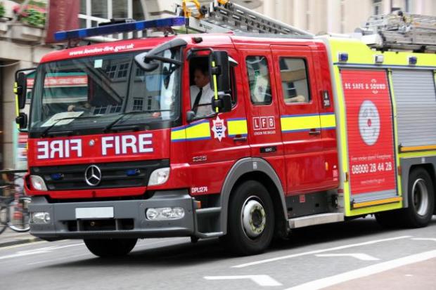 Four engines called to house fire with 'flames coming from both windows'